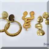 J150. 2 sets of gold tone/brass earrings and intertwined snakes pin. - $36 
